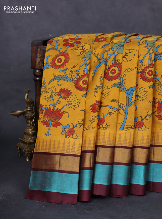 Silk cotton saree mustard yellow and coffee brown with allover kalamkari prints and temple design zari woven simple border