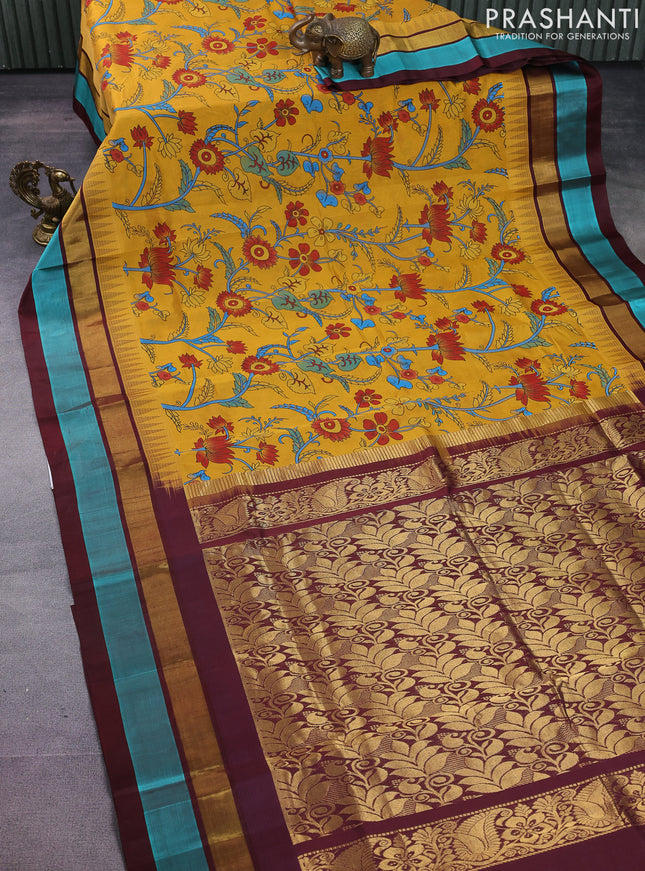 Silk cotton saree mustard yellow and coffee brown with allover kalamkari prints and temple design zari woven simple border