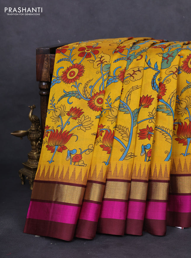 Silk cotton saree yellow and deep maroon with allover kalamkari prints and temple design zari woven simple border