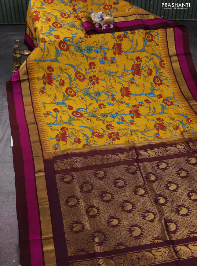 Silk cotton saree yellow and deep maroon with allover kalamkari prints and temple design zari woven simple border