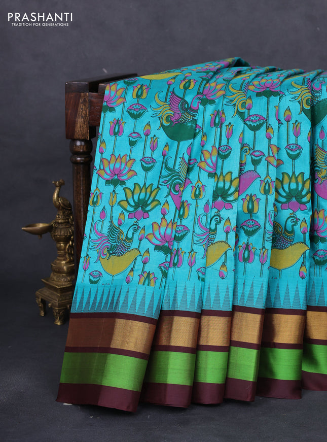 Silk cotton saree teal blue and coffee brown with allover kalamkari prints and temple design zari woven simple border
