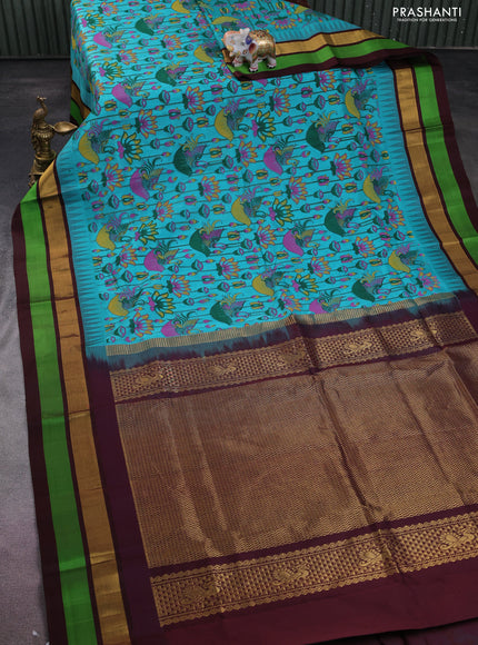 Silk cotton saree teal blue and coffee brown with allover kalamkari prints and temple design zari woven simple border