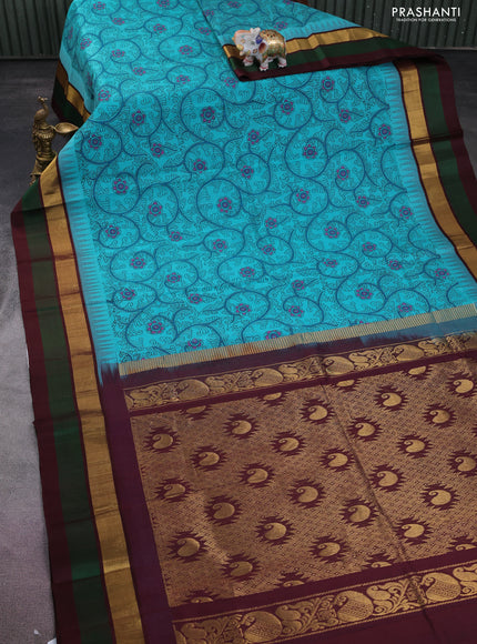 Silk cotton saree teal blue and deep maroon with allover kalamkari prints and temple design zari woven simple border