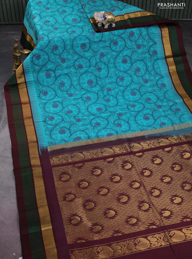Silk cotton saree teal blue and deep maroon with allover kalamkari prints and temple design zari woven simple border