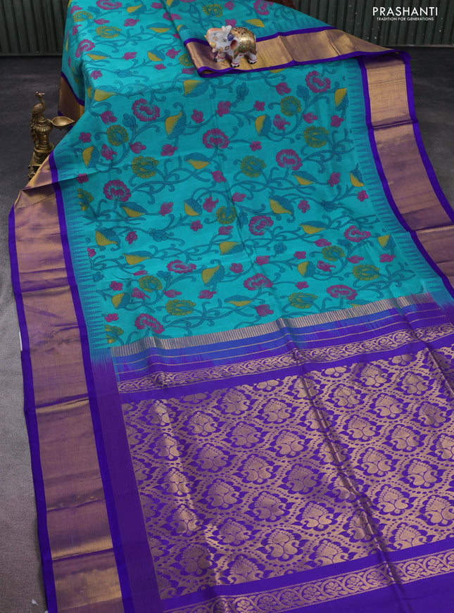 Silk cotton saree teal blue and blue with allover kalamkari prints and temple design zari woven simple border