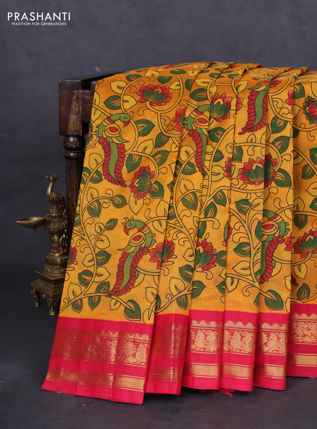 Silk cotton saree mango yellow and red with allover kalamkari prints and zari woven korvai border