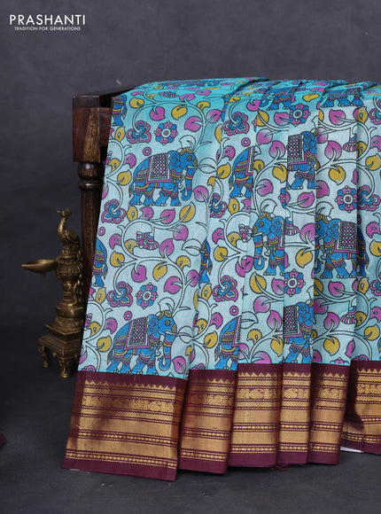Silk cotton saree teal blue and deep maroon with allover kalamkari prints and zari woven korvai border