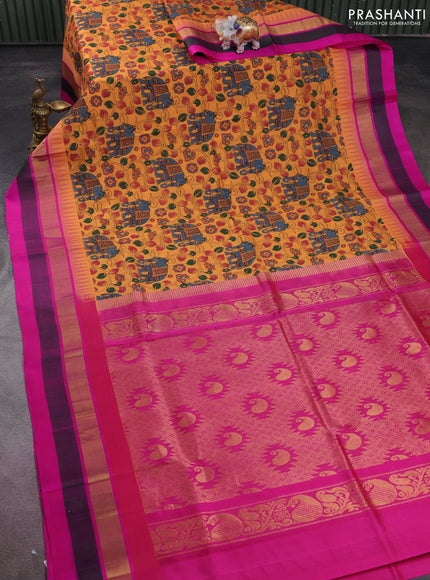 Silk cotton saree orange and pink with allover kalamkari prints and temple design zari woven simple border