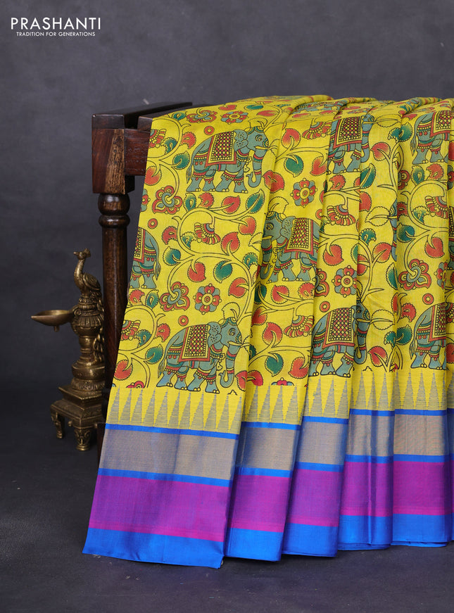 Silk cotton saree yellow and cs blue with allover kalamkari prints and temple design zari woven simple border