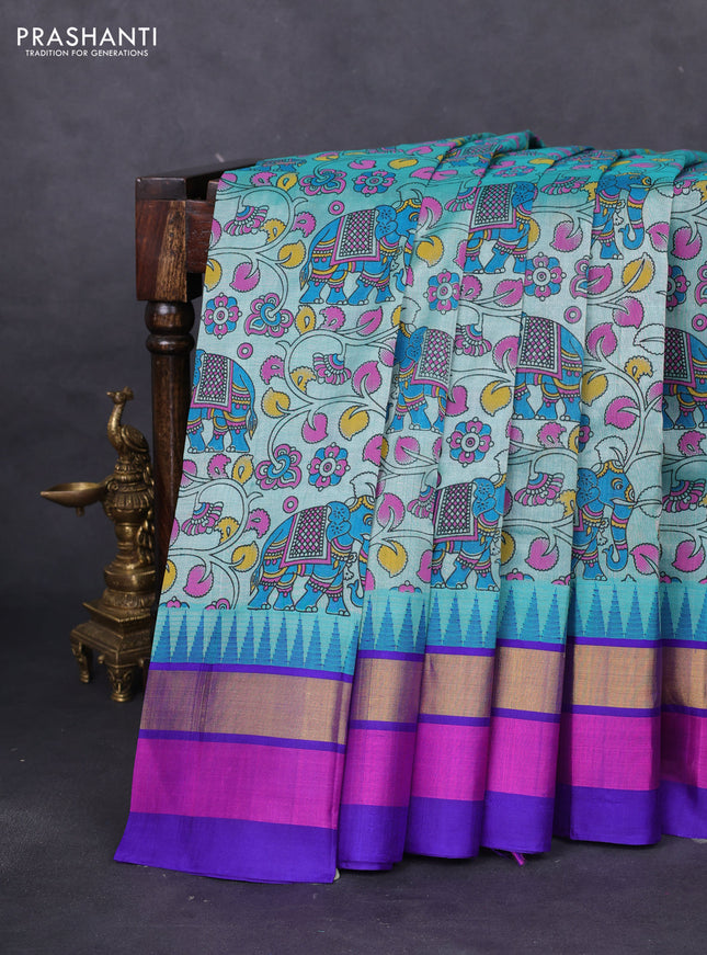 Silk cotton saree teal blue and violet shade with allover kalamkari prints and temple design zari woven simple border