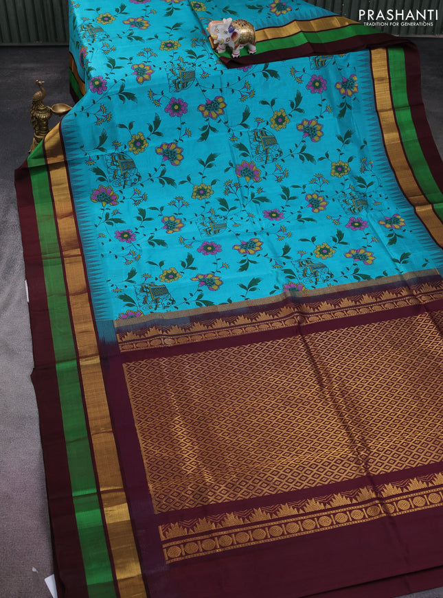 Silk cotton saree teal blue and deep maroon with allover kalamkari prints and temple design zari woven simple border