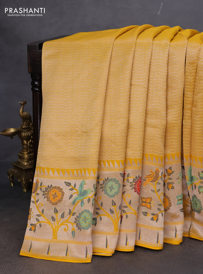 Banarasi semi raw silk saree yellow with allover zari woven brocade weaves and floral design paithani border