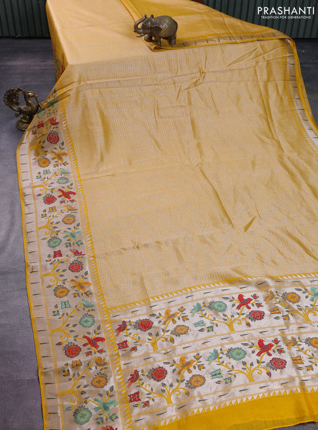 Banarasi semi raw silk saree yellow with allover zari woven brocade weaves and floral design paithani border