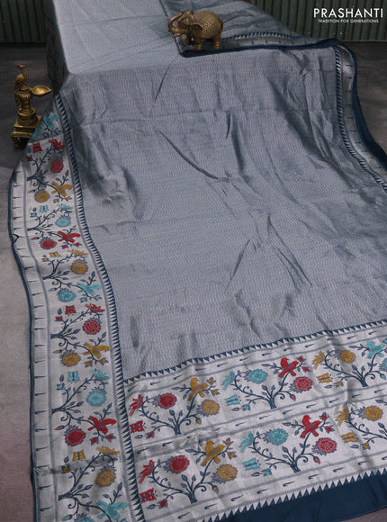 Banarasi semi raw silk saree peacock blue with allover zari woven brocade weaves and floral design paithani border