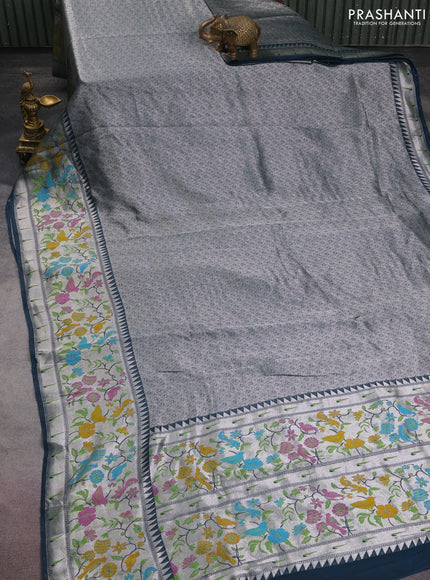 Banarasi semi raw silk saree peacock blue with allover silver woven brocade weaves and floral design paithani border
