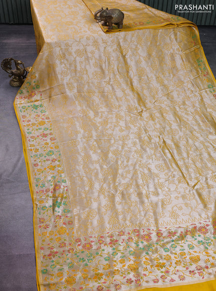 Banarasi semi raw silk saree mustard yellow with allover silver zari woven floral weaves and floral design paithani border
