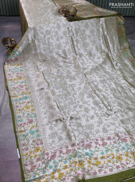 Banarasi semi raw silk saree mehendi green with allover silver zari woven floral weaves and floral design paithani border