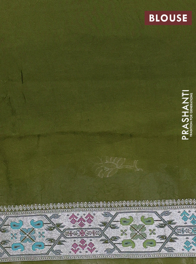 Banarasi semi raw silk saree mehendi green with allover silver zari woven floral weaves and floral design paithani border