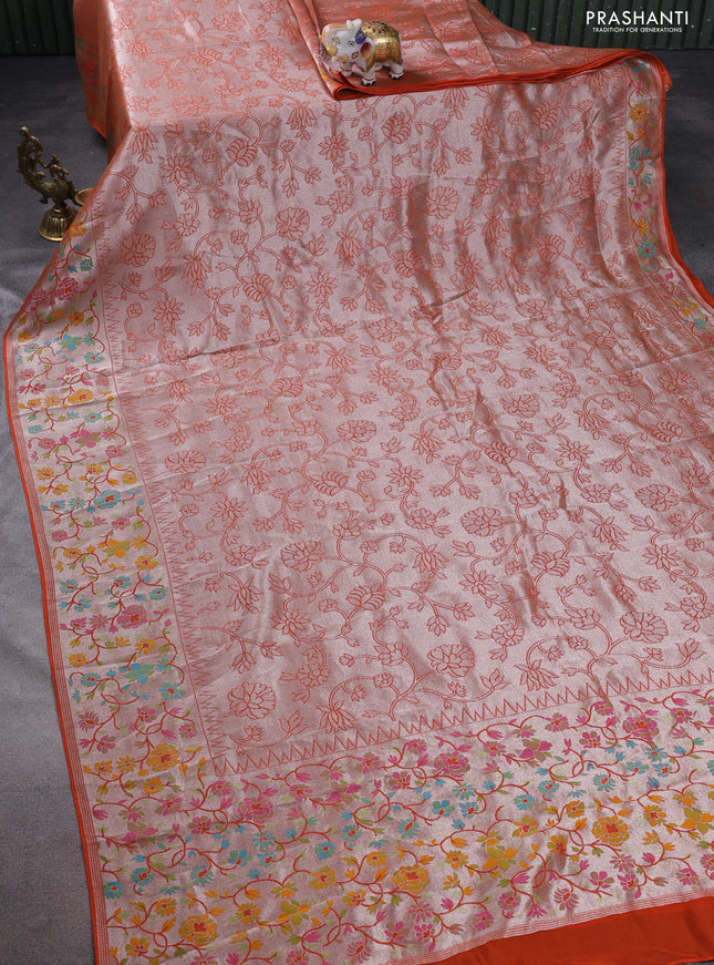 Banarasi semi raw silk saree orange with allover silver zari woven floral weaves and floral design paithani border