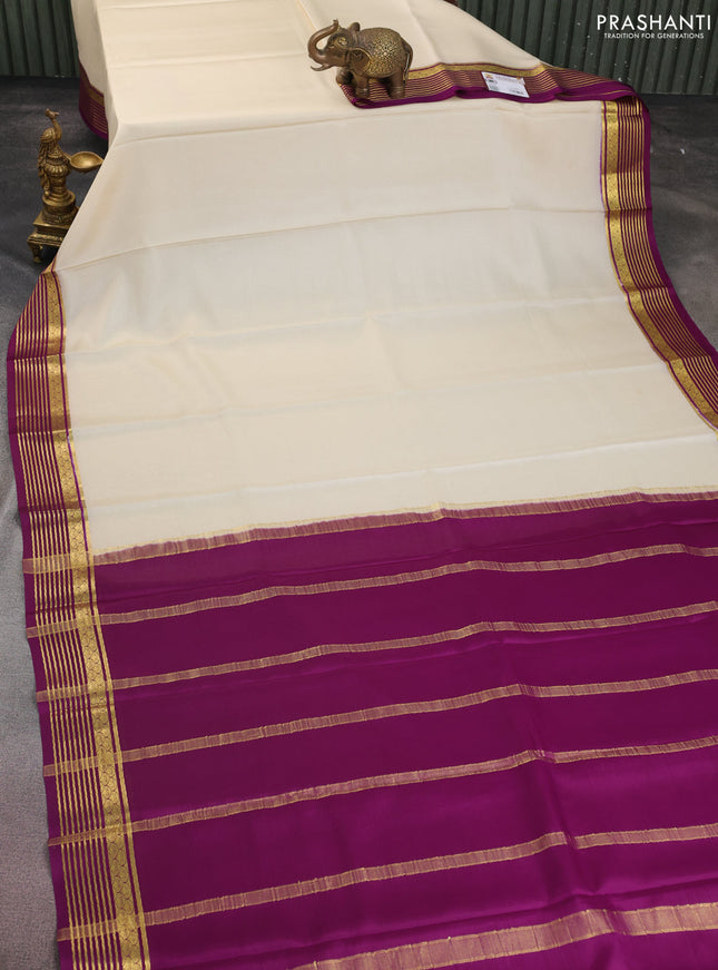 Pure mysore silk saree cream and purple with plain body and zari woven border
