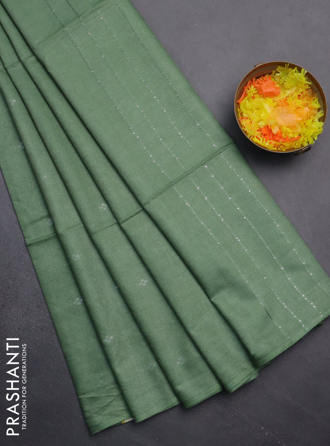 Semi bamboo saree green shade with silver zari woven buttas in borderless style