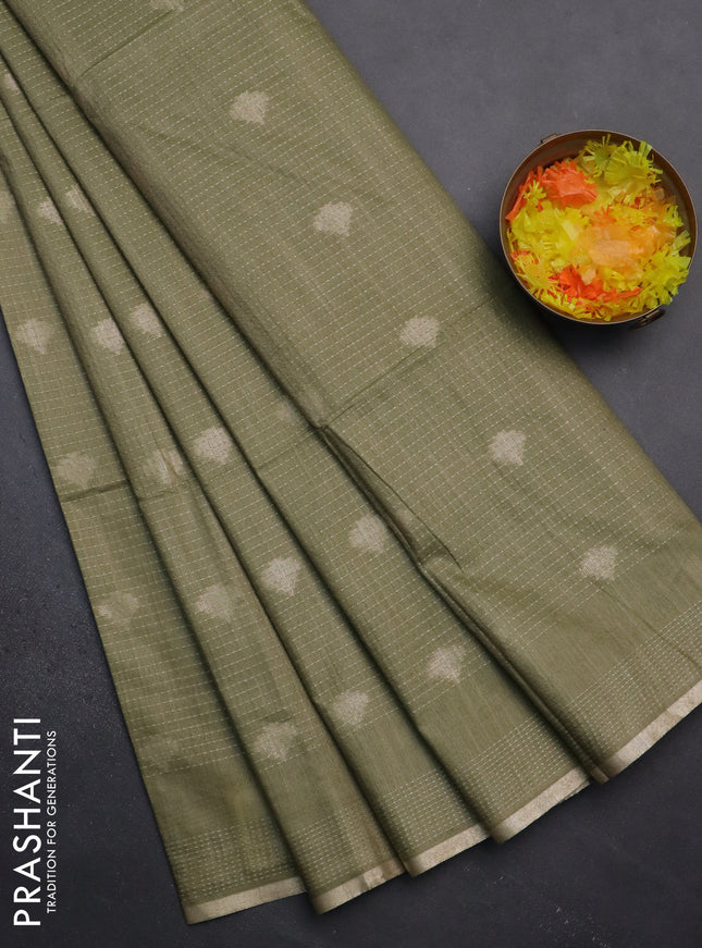 Semi bamboo saree pastel green with allover thread weaves & zari buttas and zari woven piping border