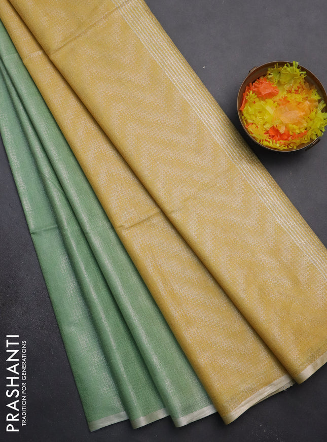Semi bamboo tissue saree pastel green and yellow with allover silver zari weaves and zari woven piping border