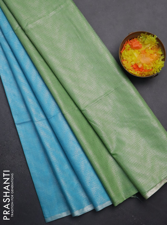 Semi bamboo tissue saree light blue and pastel green with allover silver zari weaves and zari woven piping border