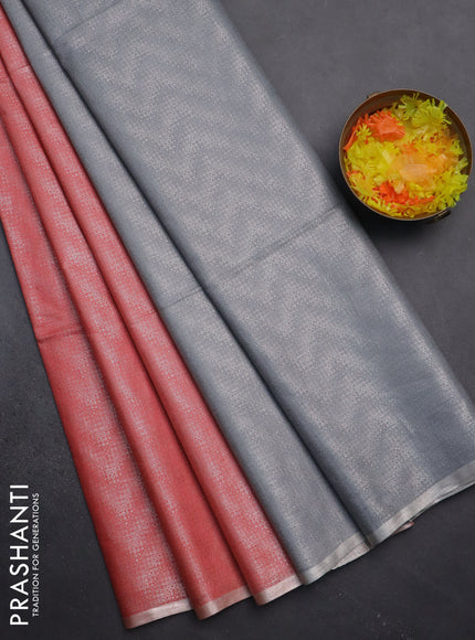 Semi bamboo tissue saree peach shade and grey with allover silver zari weaves and zari woven piping border