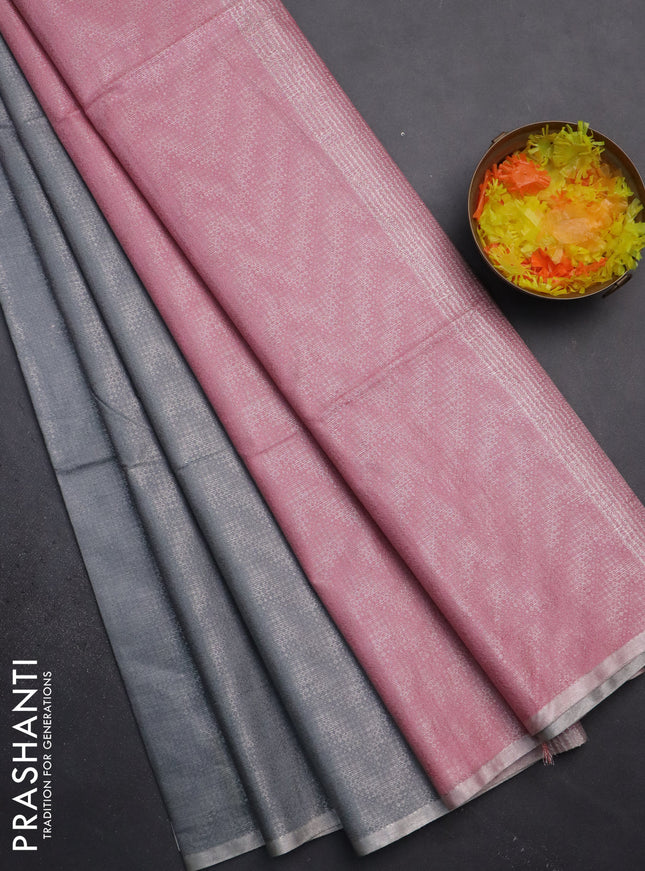 Semi bamboo tissue saree grey and peach pink with allover silver zari weaves and zari woven piping border