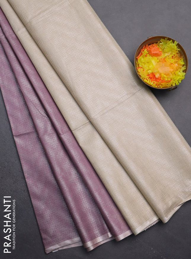Semi bamboo tissue saree pastel pink and beige with allover silver zari weaves and zari woven piping border