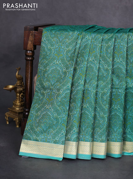 Printed silk saree teal blue with allover prints and zari woven border