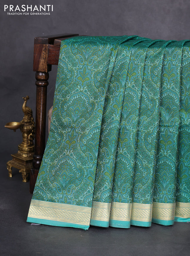 Printed silk saree teal blue with allover prints and zari woven border
