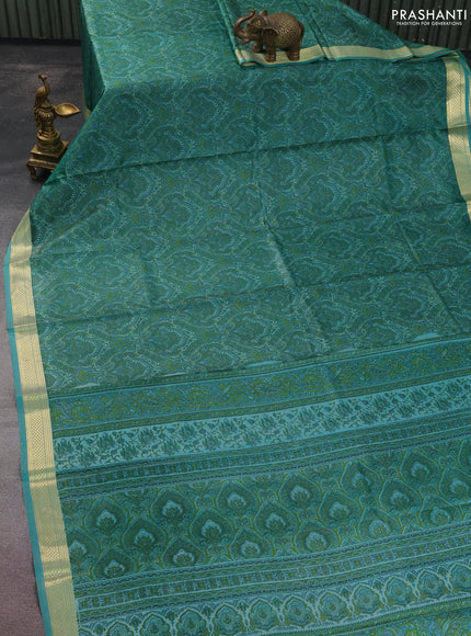 Printed silk saree teal blue with allover prints and zari woven border