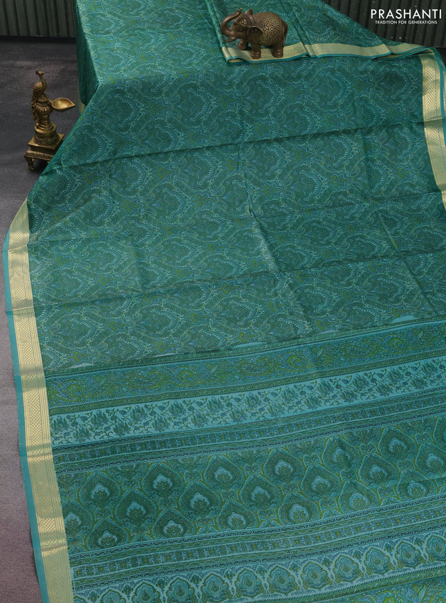 Printed silk saree teal blue with allover prints and zari woven border