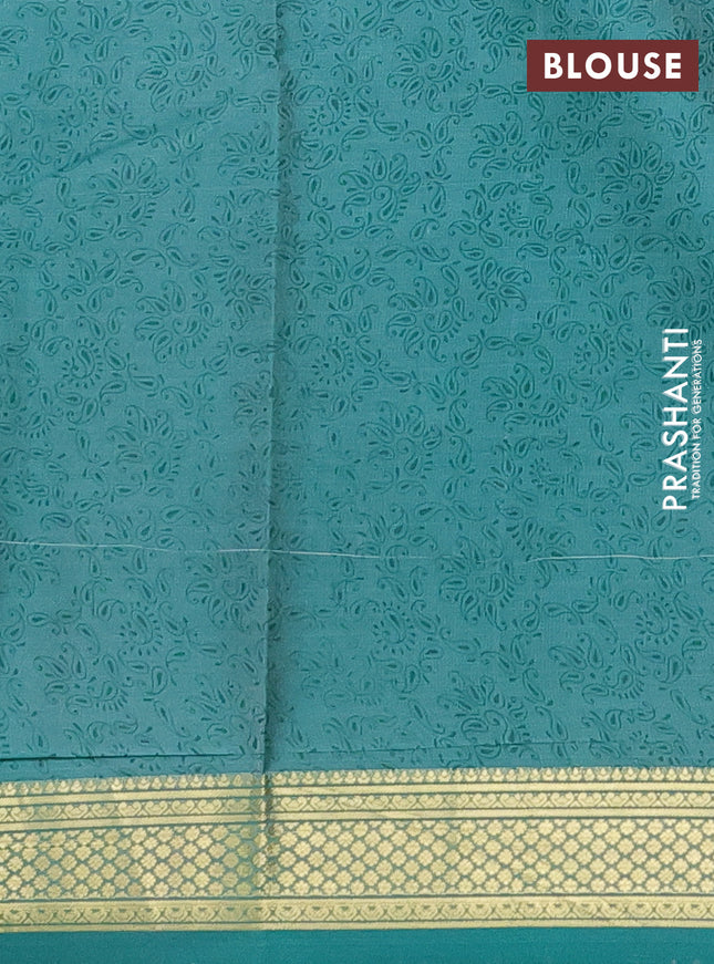 Printed silk saree teal blue with allover prints and zari woven border