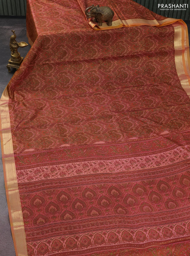 Printed silk saree dual shade of peach orange with allover prints and zari woven border