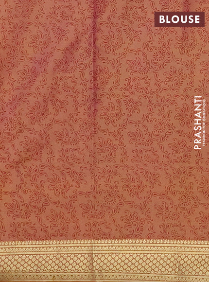 Printed silk saree dual shade of peach orange with allover prints and zari woven border