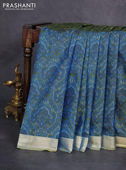 Printed silk saree dual shade of bluish yellow and l with allover prints and zari woven border