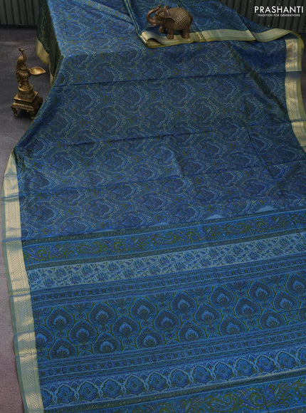 Printed silk saree dual shade of bluish yellow and l with allover prints and zari woven border