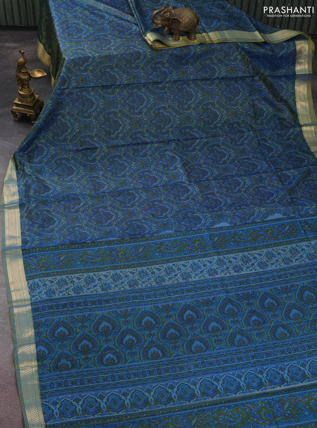 Printed silk saree dual shade of bluish yellow and l with allover prints and zari woven border