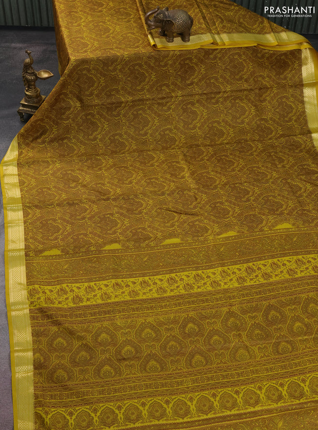 Printed silk saree mustard yellow with allover prints and zari woven border