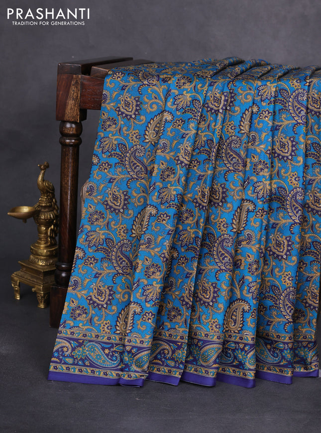 Printed silk saree cs blue and blue with allover prints and printed border