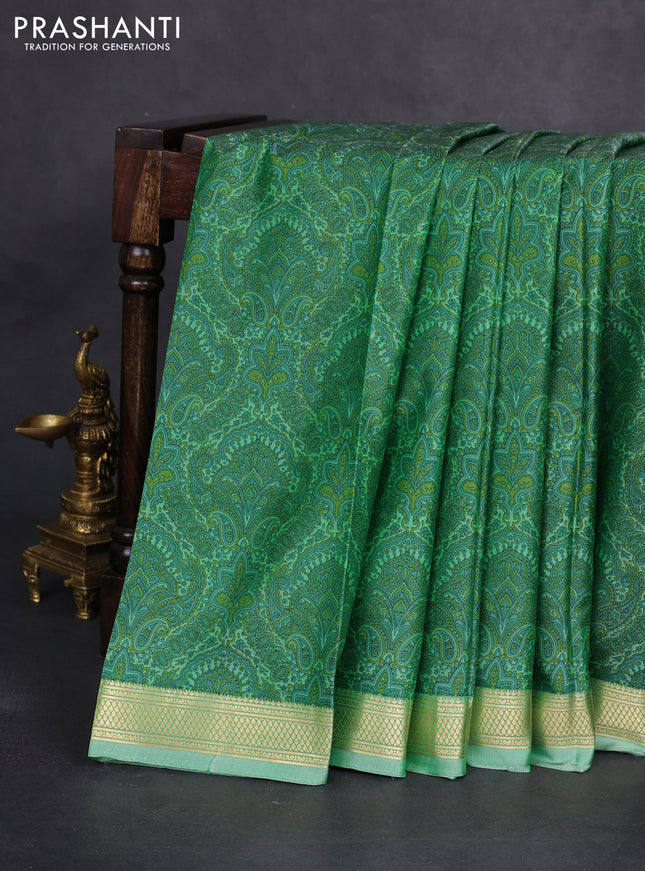 Printed silk saree pastel green with allover prints and zari woven border
