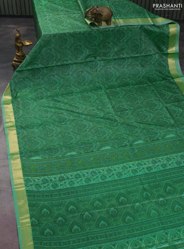 Printed silk saree pastel green with allover prints and zari woven border