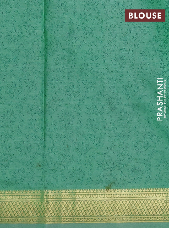 Printed silk saree pastel green with allover prints and zari woven border