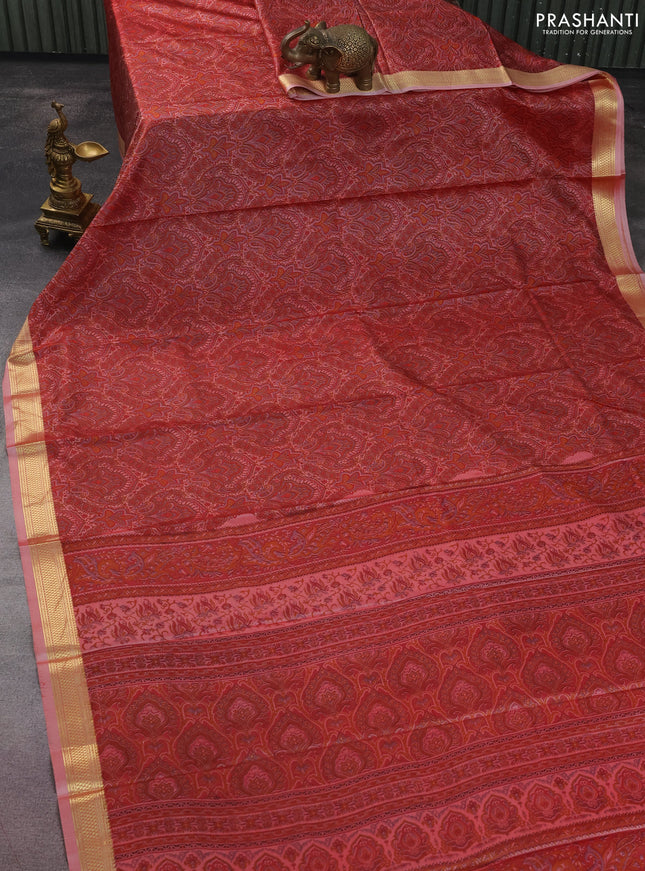 Printed silk saree red shade with allover prints and zari woven border