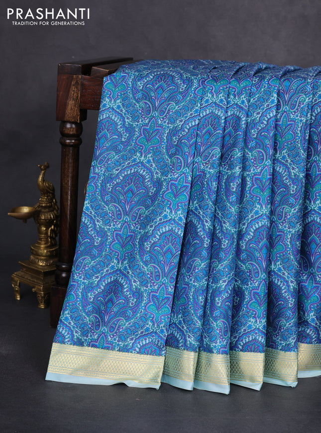 Printed silk saree light blue with allover prints and zari woven border