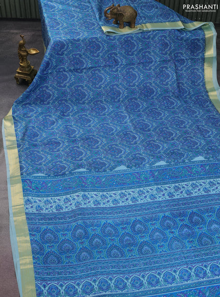 Printed silk saree light blue with allover prints and zari woven border