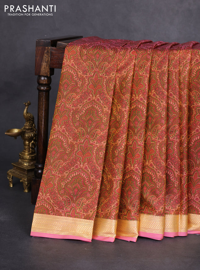Printed silk saree pastel peach and peach pink with allover prints and zari woven border